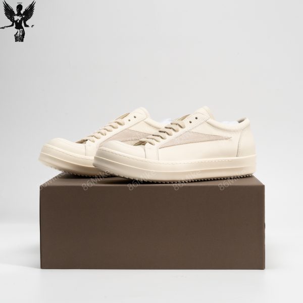 Low-top grained calfskin sneakers in off-white.